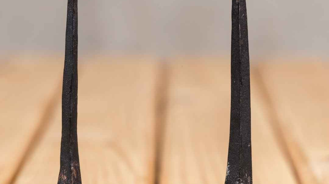 two hand forged nails