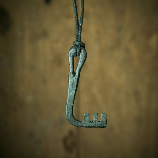 blacksmith making a viking era key and viking lock