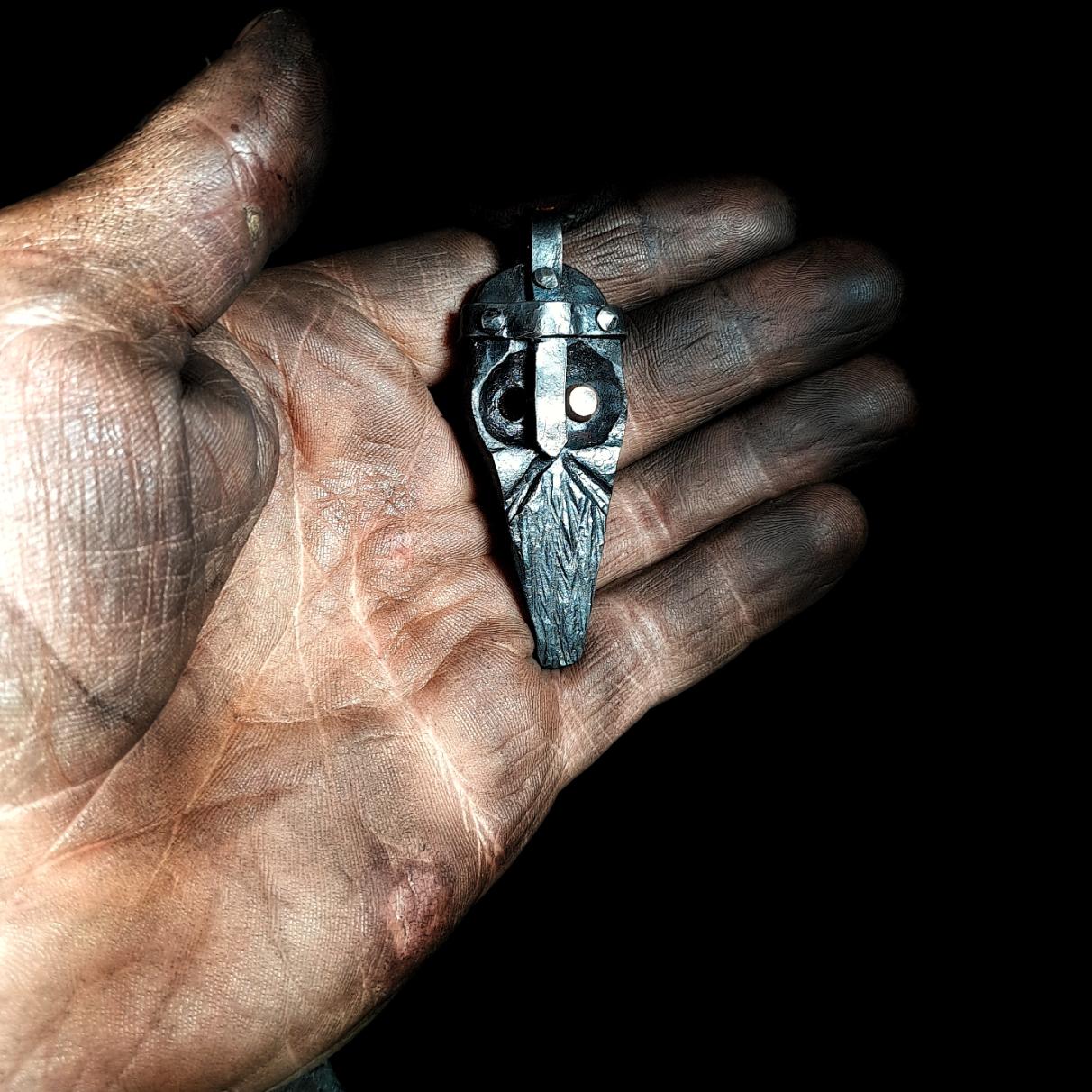 holding an odin pendant
