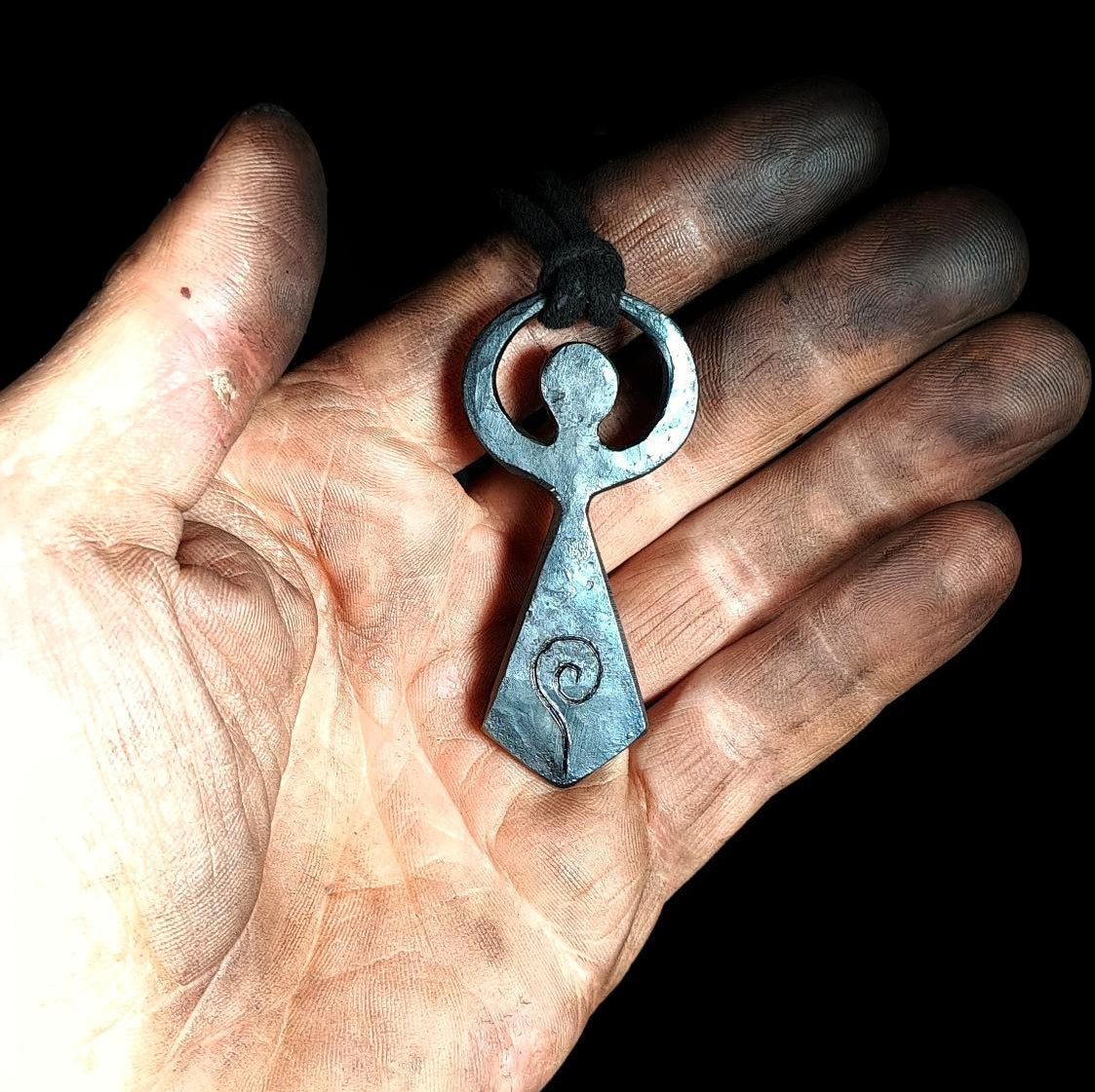 holding a moon goddess pendant