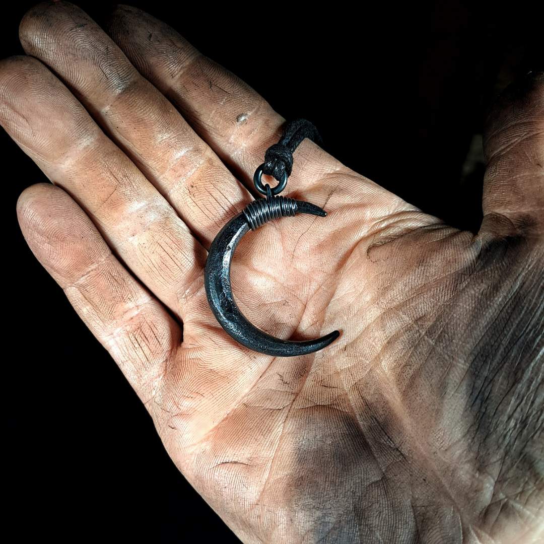 moon pendant in hand