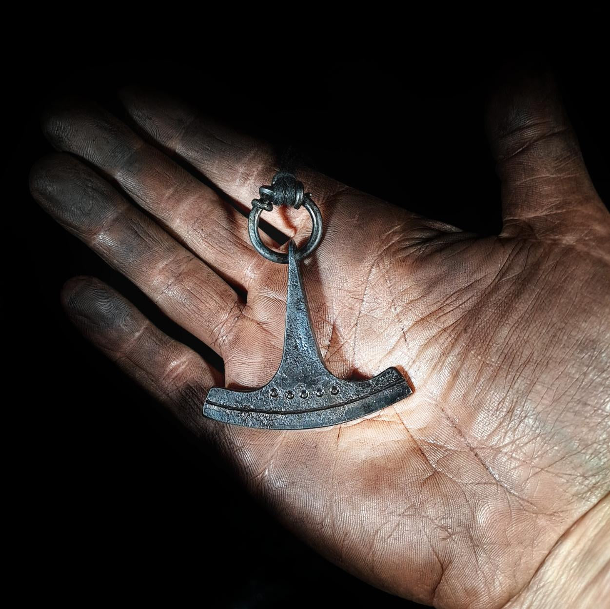 holding an ukonvasara pendant