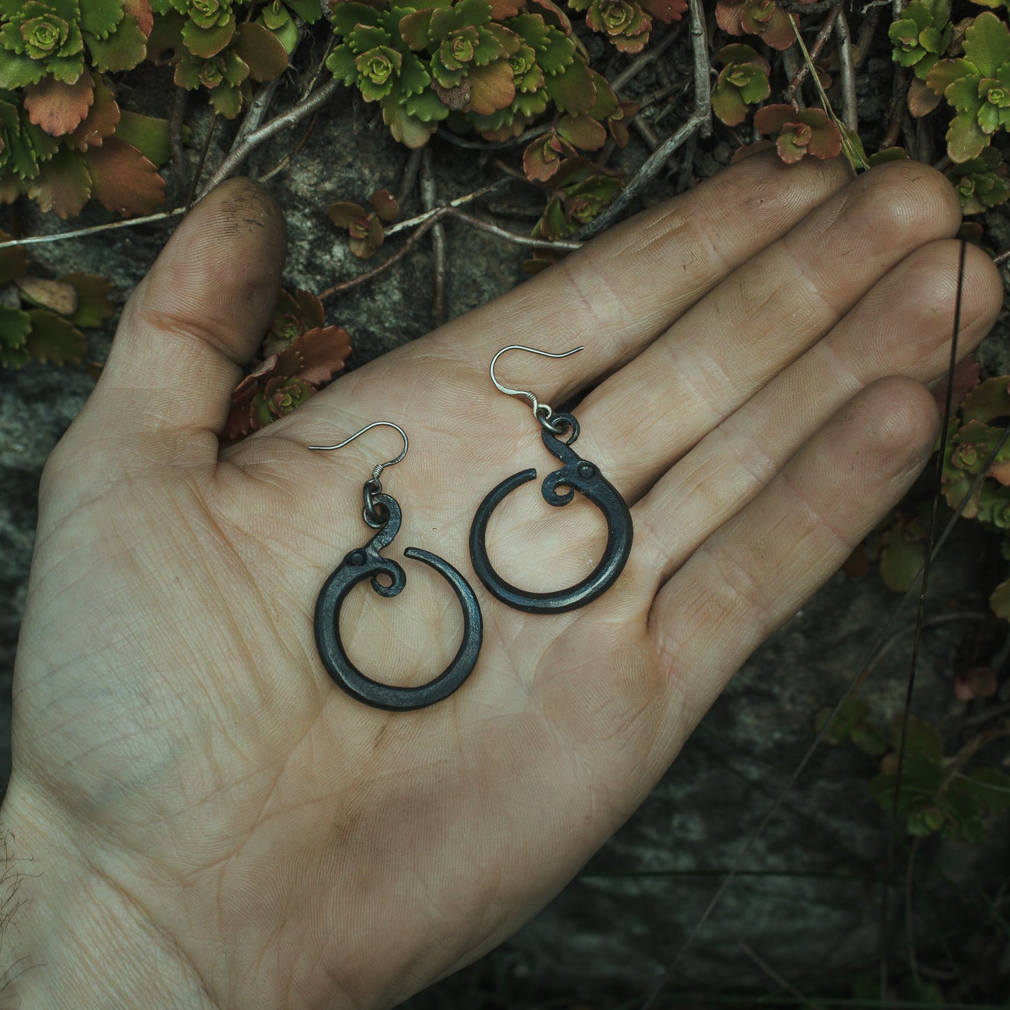 Jormungandr the Midgard serpent. World serpent earrings, an ouroboros