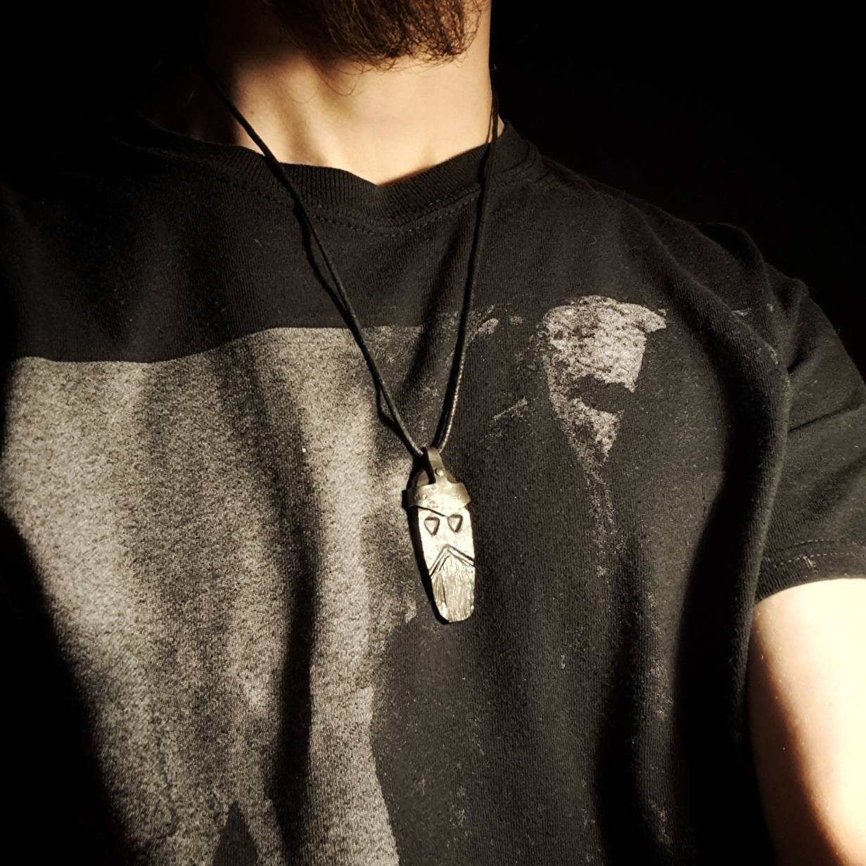 model wearing a norse god thor pendant