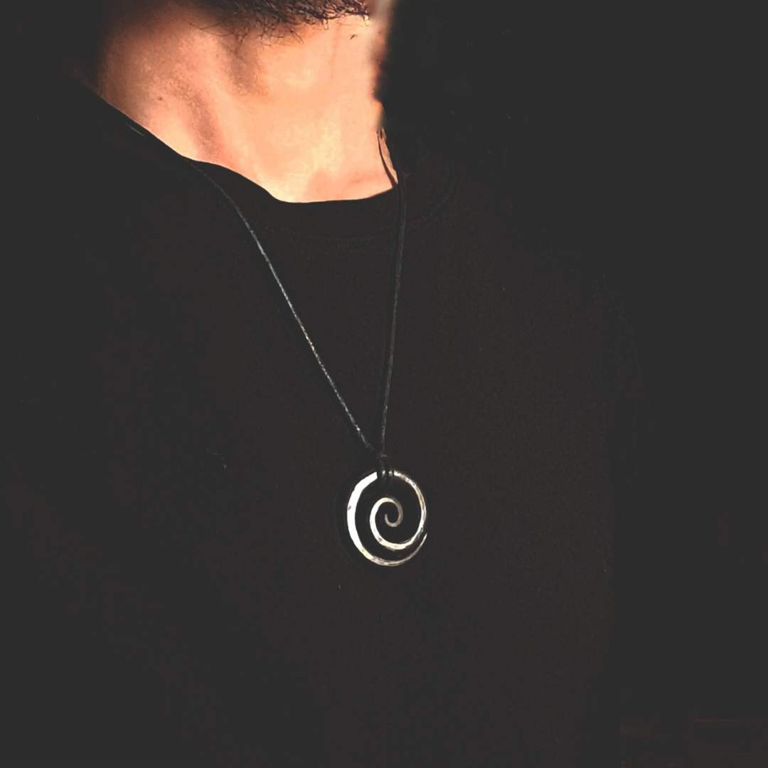 A model wearing the spiral pendant, highlighting its elegant design and captivating presence.