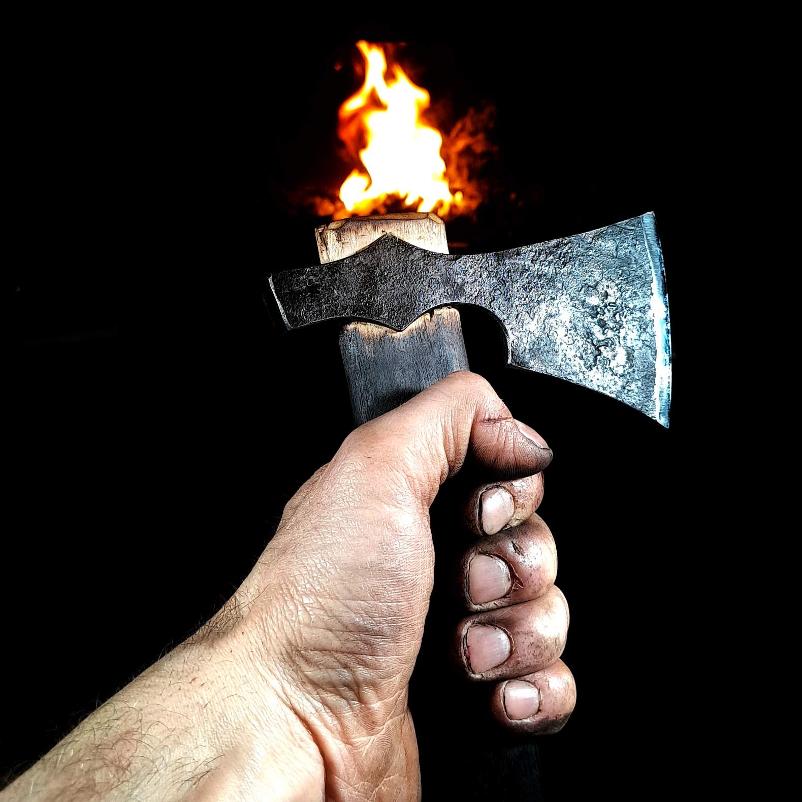 A photo of a skilled bushcraft enthusiast using an authentic hand-forged Viking axe to chop firewood. The axe is being used with precision and control, producing clean, well-placed cuts.