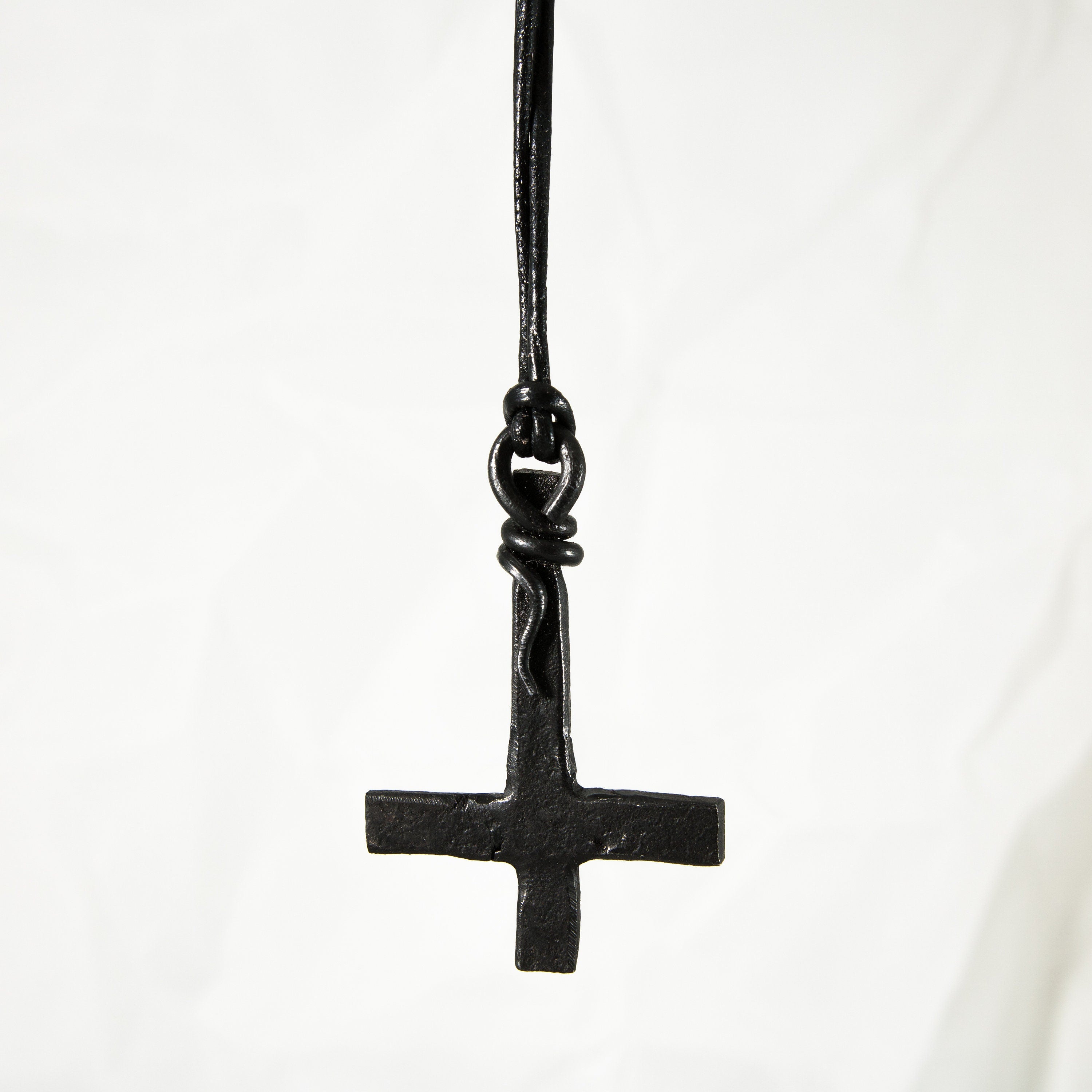 Inverted cross pendant