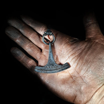 holding an ukonvasara pendant