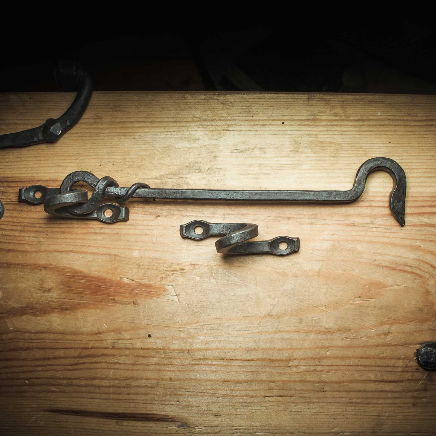 Traditional forged gate latch with decorative loop